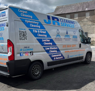 JR Cleaning Services’ branded carpet and upholstery cleaning van